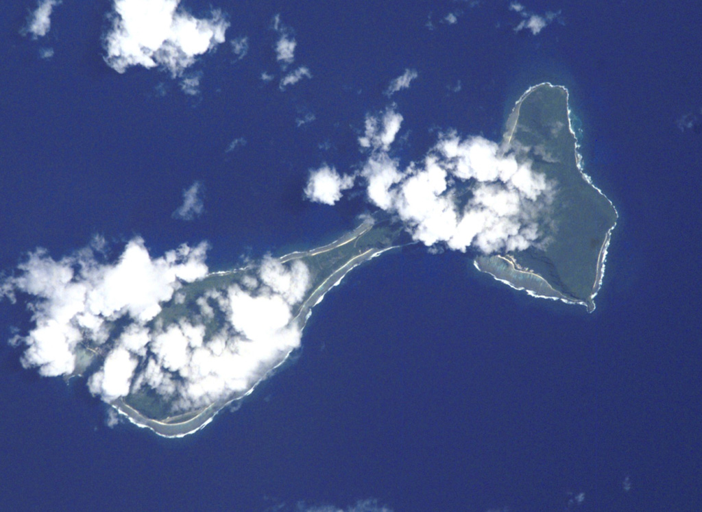 
Clouds drape the tops of the two islands of Ofu (left) and Olosega (right) in eastern Samoa in this International Space Station image (N is to the top left). The islands, 6 km in combined length, are separated by a narrow strait. They are formed by two eroded, coalescing basaltic shield volcanoes truncated by mostly-submarine calderas. A submarine eruption took place in 1866 about 3 km SE of Olosega, along the ridge connecting Olosega with Ta'u Island.
 NASA International Space Station image ISS002-E-6878, 2001 (http://eol.jsc.nasa.gov/).