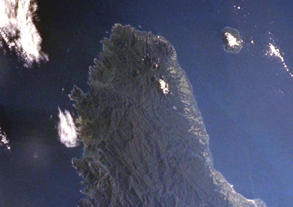 The Pliocene-to-Quaternary Gallego volcanics cover a large area of NW Guadalcanal Island along the top part of this NASA International Space Station image (N is to the upper right). Local traditions mention a historical eruption from Mount Roundhead, but this could refer to an eruption from Savo volcano, the island to the upper right. Mount Esperance volcano rises above Cape Esperance, across the channel from Savo Island. The city of Honiara lies along the northern coast of Guadalcanal Island at the lower right. NASA International Space Station image ISS002-727A-10, 2001 (http://eol.jsc.nasa.gov/).