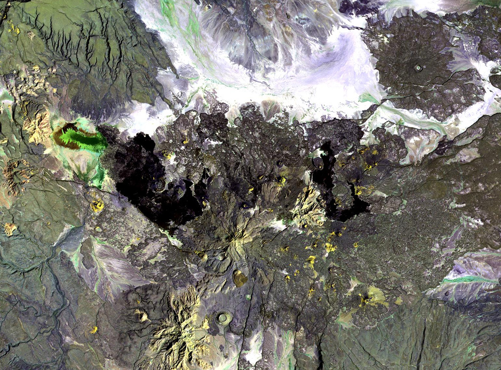 Gabillema is located along the axis of the Addado graben. The summit of the volcano lies below and to the left of the center of this Landsat image. Rhyolitic lava domes are on the flanks of the volcano and a 5 x 17 km basaltic lava field covers the Ado Bad Plain (Ado Lake) N of the volcano, originating from a broad area of fissure vents and spatter cones on the N side. NASA Landsat image, 1999 (courtesy of Hawaii Synergy Project, Univ. of Hawaii Institute of Geophysics & Planetology).