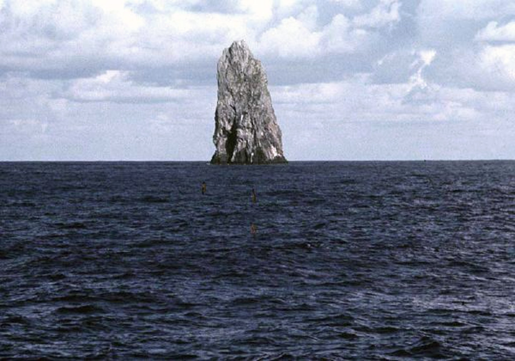 The Sofugan pinnacle seen here from the W rises about 100 m above the ocean surface south of Torishima volcano. It is the remnant of a large volcano that is 28 km wide at its base and rose 2,200 m above the sea floor. In 1975 discolored sea water was observed about 500 m N. Copyrighted photo by Makoto Yuasa, 1985 (Japanese Quaternary Volcanoes database, RIODB, http://riodb02.ibase.aist.go.jp/strata/VOL_JP/EN/index.htm and Geol Surv Japan, AIST, http://www.gsj.jp/).