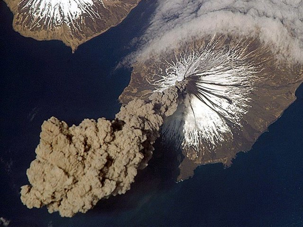 Eruption of Cleveland on 23 May 2006 as photographed from the International Space Station at an orbital altitude of approximately 400 km. The photograph shows the ash plume moving SW from the summit with N at the top and Carlisle Island to the NW. Courtesy of Jeffrey N. Williams, Flight Engineer and NASA Science Officer, International Space Station Expedition 13 Crew, NASA Earth Observatory.
