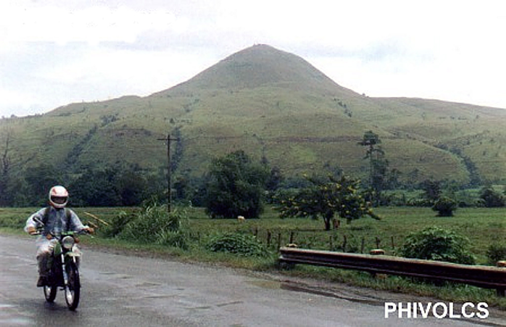The grass-covered Musuan volcano, also known as Calayo, is an isolated lava dome and tuff cone that rises more than 600 m above flat farmland in the province of Bukidnon in central Mindanao. Photo courtesy of PHIVOLCS.