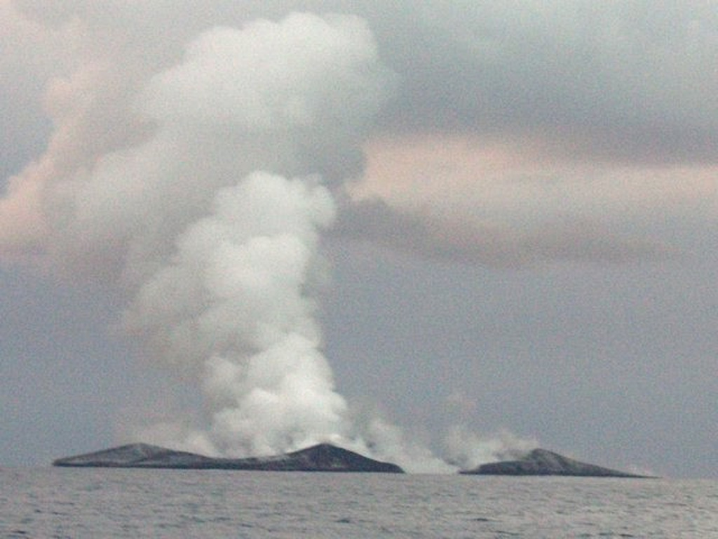 Plumes rise above a new island being built by the eruption at Home Reef as seen from the east about 2.8 km away on 12 August 2006. The island at this time was ~1.5 km in diameter. The eruption began on 7 August and lasted until about the 16th. Widespread pumice rafts reached Fiji and as far as Australia. Photo by Fredrik Fransson, 2006.