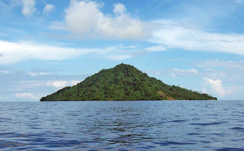 The small forested island of Narage in the Bismarck Sea north of western New Britain is the northernmost of the Witu (or Vitu) Islands. Narage is the summit of a Pleistocene volcano that rises about 300 m above sea level and has strong thermal activity. Boiling springs and a geyser are found along the coast and a 45-m-high geyser was observed at a sandbank 8 km offshore in 1863. Photo by Jean Guillou, courtesy of René Guenerie.