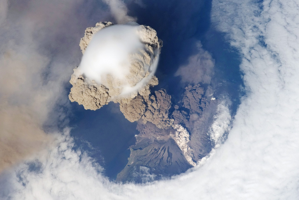 One of the largest recorded eruptions in the Kuril Islands took place 11-16 June from Sarychev Peak. This NASA Space Shuttle view on 12 June shows an eruption plume that rose to 16-21 km altitude; pyroclastic flows reached the sea and extended the shoreline in some areas. The main explosive phase ended on 16 June, but weak explosions producing ash plumes continued prior to arrival of a field team on 26-28 July, when no eruptive activity was observed. NASA International Space Station image  ISS020-E-9048, 2009 (http://eol.jsc.nasa.gov/).