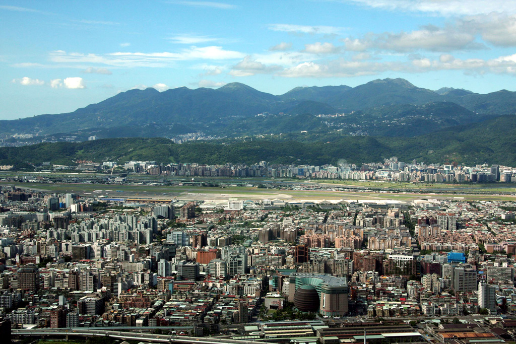 The Tatun (Datun) volcano group contains around 20 lava domes and is seen here NE of Taipei, the capital city of Taiwan. The latest eruptions are late Pleistocene and mid-Holocene. Hot springs, fumaroles, and solfataras are found over wide areas. Photo by Alexander Belousov, 2008 (Institute of Volcanology, Kamchatka, Russia).