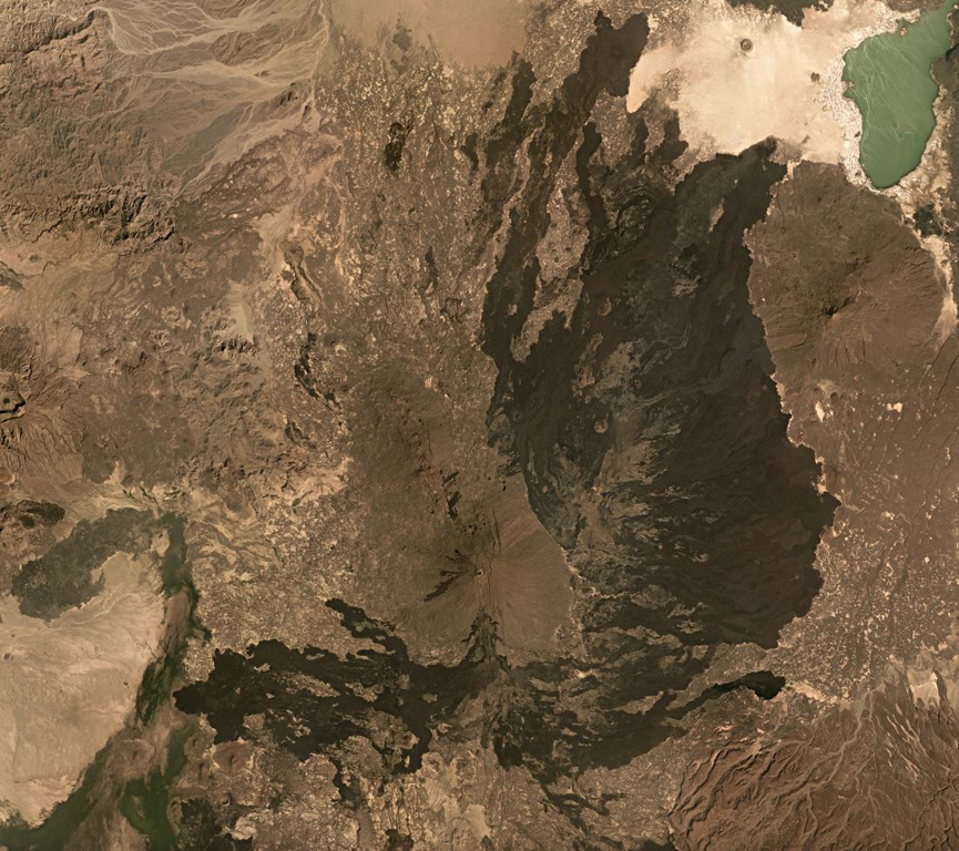 The Alayta shield volcano is in the center of this December 2019 Planet Labs satellite image mosaic (N is at the top; this image is approximately 82 km across), with a series of vents along the axis and darker lava flow fields surround much of the edifice. The flows reach Afderà to the NE. Lake Afrera is in the NE corner of the image. Satellite image courtesy of Planet Labs Inc., 2019 (https://www.planet.com/).