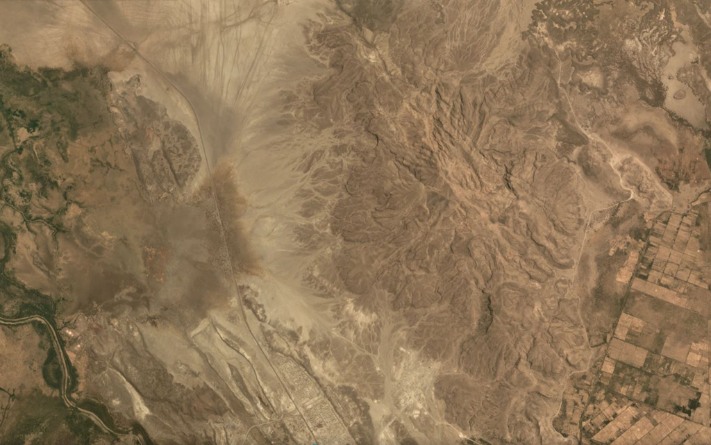 The Borawli lava dome complex is near the center (right) of this May 2019 Planet Labs satellite image mosaic (N is at the top; this image is approximately 12 km across). The eroded edifice is located in the southern Kali Plain of Ethiopia, around 200 km S of Erta Ale, and contains obsidian flows. Satellite image courtesy of Planet Labs Inc., 2019 (https://www.planet.com/).
