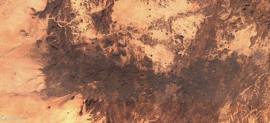 The E-W-trending Tahalra Volcanic Field within the Hoggar Province of southern Algeria covers an area of around 1,800 km2, seen here in this 3 December 2019 Sentinel-2 satellite image (N is at the top). Numerous cones and craters are visible across the image. Satellite image courtesy of Copernicus Sentinel Data, 2019.