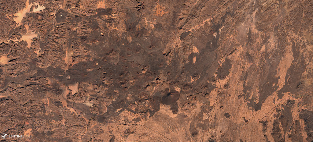 Scoria cones, craters, and lava flows are visible across the Tarso Tôh volcanic field in this 3 December 2019 Sentinel-2 satellite image (N at the top). This field in the NW portion of the Tibesti Range of Chad contains around 150 identified volcanic centers. This image shows an area approximately 45 km across. Satellite image courtesy of Copernicus Sentinel Data, 2019.