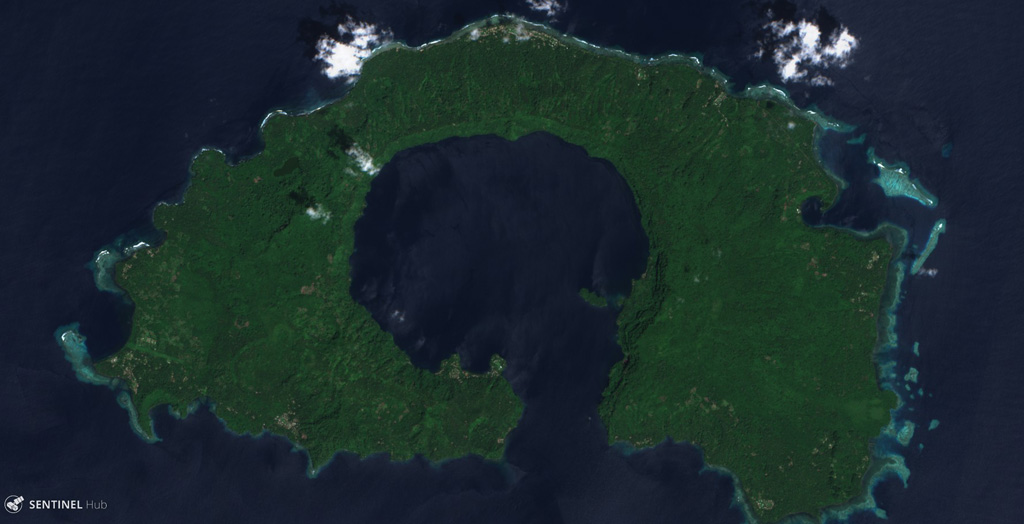 The center of Garove Island is a lagoon likely formed through edifice collapse, with debris avalanche deposits offshore. Cones have formed across the flanks, with Peter Hafen crater along the NE coast visible in this 4 December 2019 Sentinel-2 satellite image (N is at the top; this image is approximately 15 km across). Satellite image courtesy of Copernicus Sentinel Data, 2019.