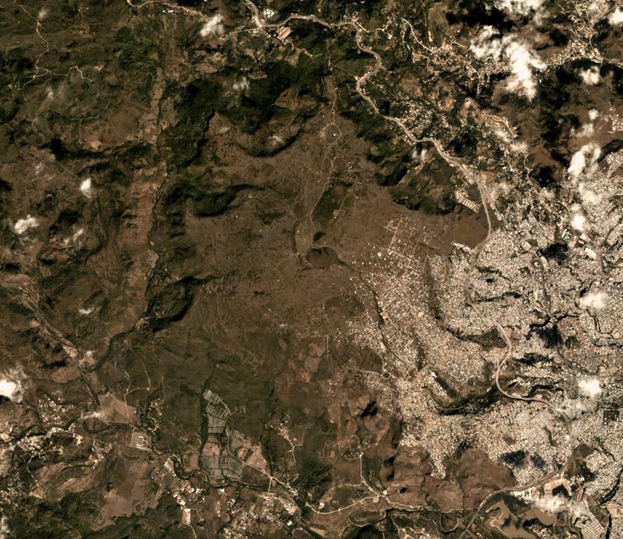 El Pedregal is near the center of this January 2019 Planet Labs satellite image monthly mosaic (N is at the top; the image is approximately 10 km across. Remnants of lava flows and separate vents occur over broad areas to the W and NW, and the capital city of Tegucigalpa is to the E. Satellite image courtesy of Planet Labs Inc., 2019 (https://www.planet.com/).