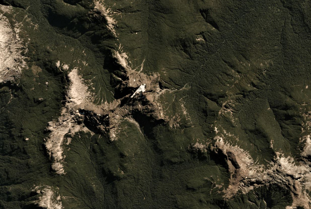 Cuernos del Diablo is a small glacially eroded edifice in Chile, seen here in this 26 March 2019 Planet Scope satellite image (N is at the top; this image is approximately 9.5 km across). The volcano formed numerous smaller cones and lava flows during the Holocene. Satellite image courtesy of Planet Labs Inc., 2019 (https://www.planet.com/).