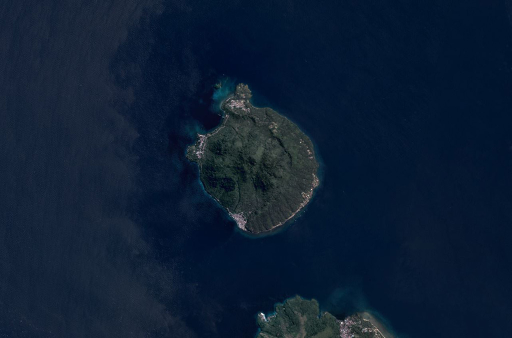 Hiri is a 3-km-wide volcanic island north of Ternate Island (in the bottom of this image) off the coast of Halmahera island and is in the center of this June 2019 Planet Labs satellite image monthly mosaic (N is at the top). The highest part of the island has formed within a broad circular scarp that opens towards the W. Satellite image courtesy of Planet Labs Inc., 2019 (https://www.planet.com/).
