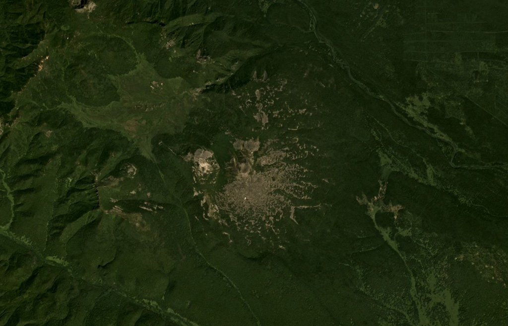 Plosky volcano in the Sredinny Range, Kamchatka, is shown in this July 2019 Planet Labs satellite image monthly mosaic (N is at the top; this image is approximately 17 km across). A small cone is at the summit with a crater or scarp opening towards the NW, on top of the broad lower edifice. Satellite image courtesy of Planet Labs Inc., 2019 (https://www.planet.com/).