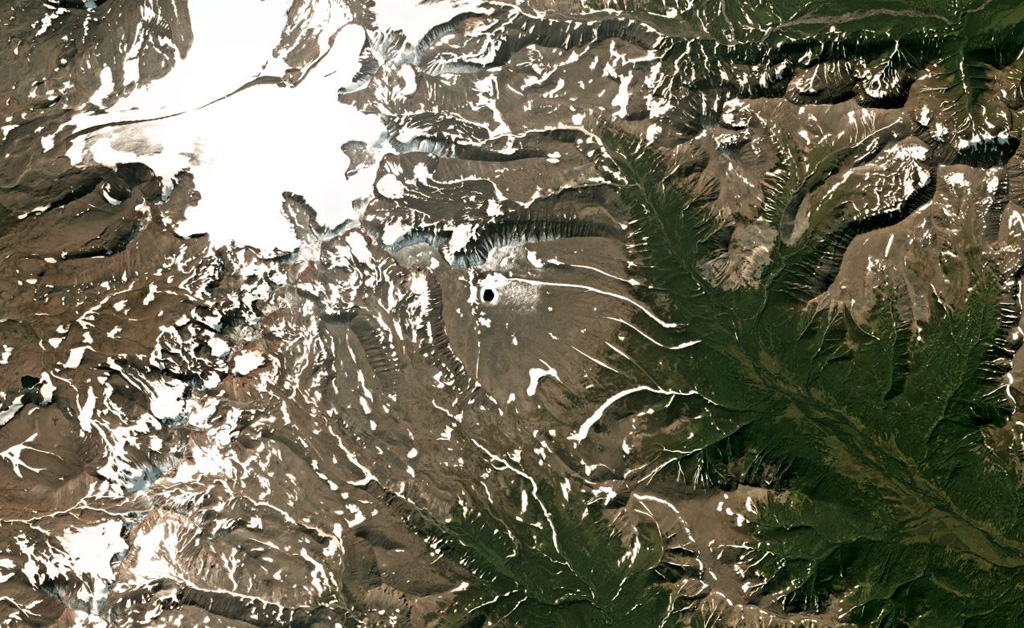 Kaileney is located in northern Kamchatka and is shown in this August 2019 Planet Labs satellite image monthly mosaic (N is at the top; this image is approximately 27 km across). The northern flank has undergone extensive glacial erosion, and two small cones are on the summit area. Satellite image courtesy of Planet Labs Inc., 2018 (https://www.planet.com/).