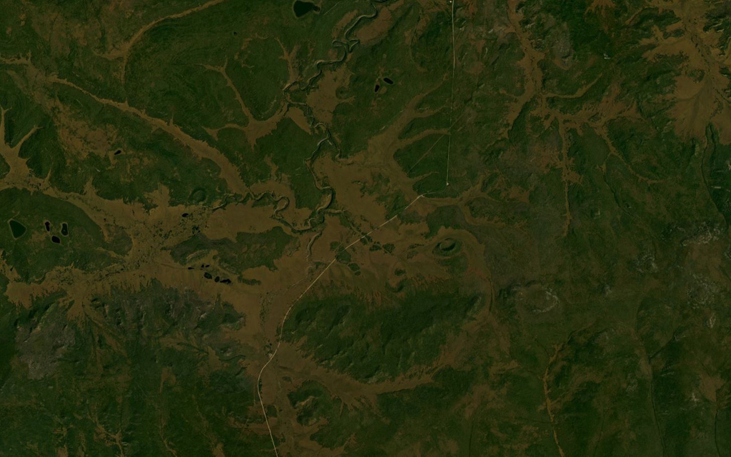 The Vitim Volcanic Field covers an area of around 4,500 km2. A smaller area approximately 34 km across that contains several craters is shown in this August 2019 Planet Labs satellite image monthly mosaic (N is at the top). The field is located about 200 km E of northern Lake Baikal, along the Vitim River. The majority of the eruption centers are in the NW portion of the field. Satellite image courtesy of Planet Labs Inc., 2019 (https://www.planet.com/).