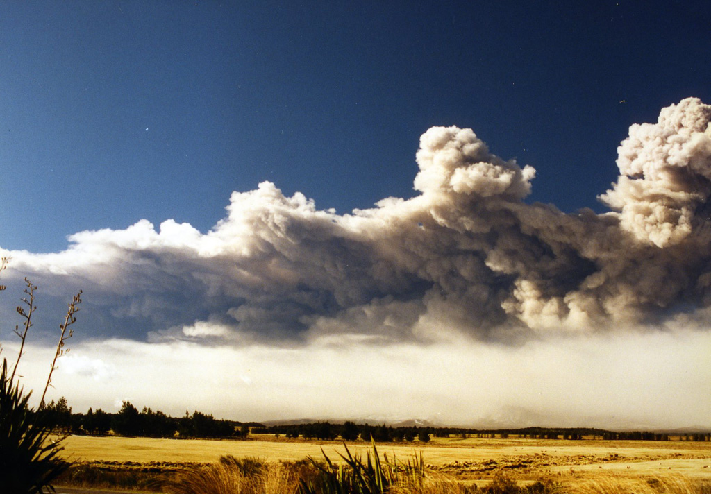 This 17 June 1996 photo shows the ash plume produced during the Ruapehu eruption that extended out to around 200 km, drifting over the Pacific Ocean. Below the main plume is the ash redispersing from the deposit emplaced across a narrow swath NE of the volcano. Photo by John A Krippner, 1996.