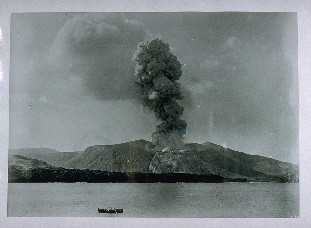An eruption plume rises above Fossa cone on Vulcano in 1888 in this photo taken from a position offshore to the NE during the last historical eruption of the volcano.  The eruption began on August 2, and persistant explosive activity, occasionally accompanied by minor pyroclastic surges, continued until March 22, 1890. From the collection of Maurice and Katia Krafft.