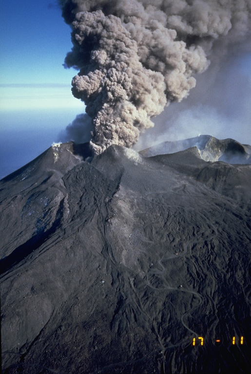 An ash plume rises above Etna’s NE Crater on 24 September 1986. This marked the end of an eruption episode that began in July 1984. Intermittent explosive eruptions from the Northeast Crater took place for two years. In July 1986, Strombolian eruptions formed a scoria cone in the crater. On 14 September 1986 lava overtopped the west rim of Northeast Crater and flowed 1.5 km down its flank. Photo by Romolo Romano, 1986 (IIV-CNR, Catania, Italy).