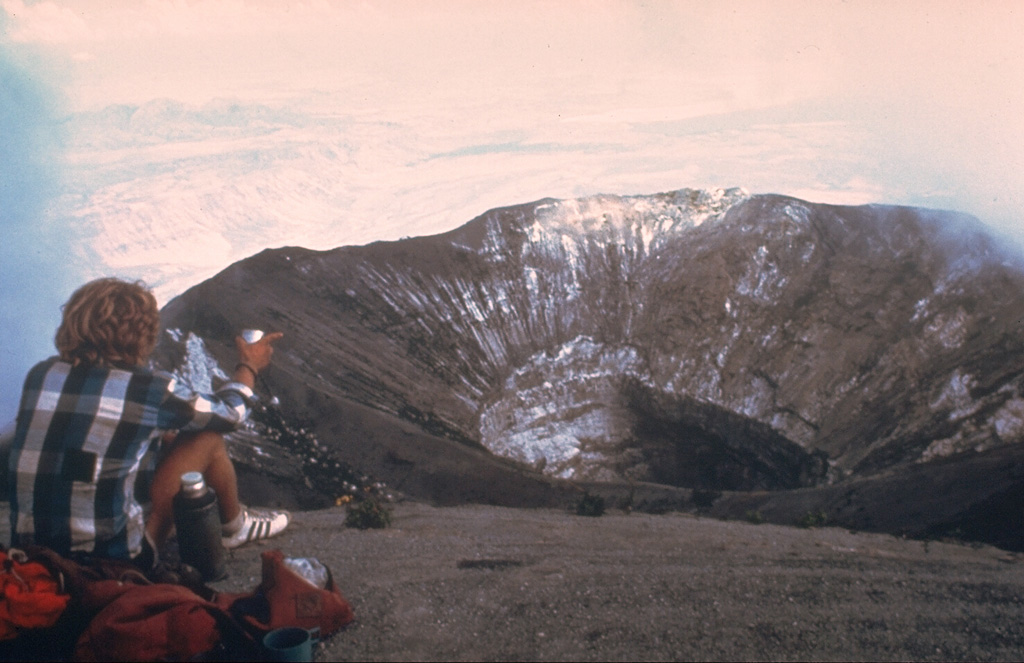 The northern crater of Ol Doinyo Lengai is seen here in February 1980 from the summit. The steep-walled inner crater formed during the explosive eruptions of 1966 and 1967. Another eruption began three years after this photo was taken. By December 1988 the crater filled with lava that had overflowed the near southern crater rim at the lower center of the photo. Photo by Peterson, 1980 (courtesy of Celia Nyamweru, Kenyatta University).