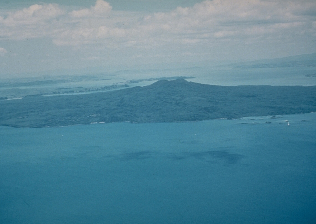 Rangitoto, a 6-km-wide island seen here from the NW, is the youngest feature of New Zealand's Auckland Volcanic Field. The volcano erupted at least twice, about 620 and 570 years ago, and is capped by a scoria cone containing a deep crater. Photo by Jim Cole (University of Canterbury).