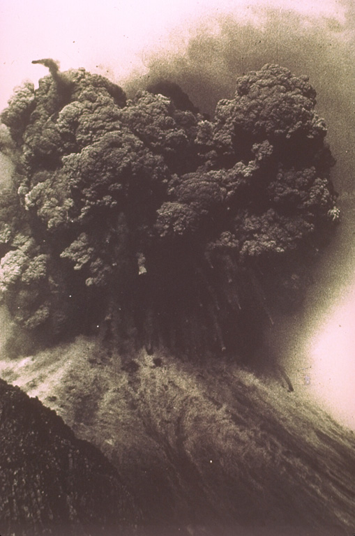 A Vulcanian explosion from the Ngauruhoe cone of Tongariro volcano in New Zealand on 19 February ejects an ash plume and ballistic ejecta. Blocks up to 20 m across reached hundreds of meters above the vent before impacting the flanks. Photo by Ian Nairn, 1975 (New Zealand Geological Survey).