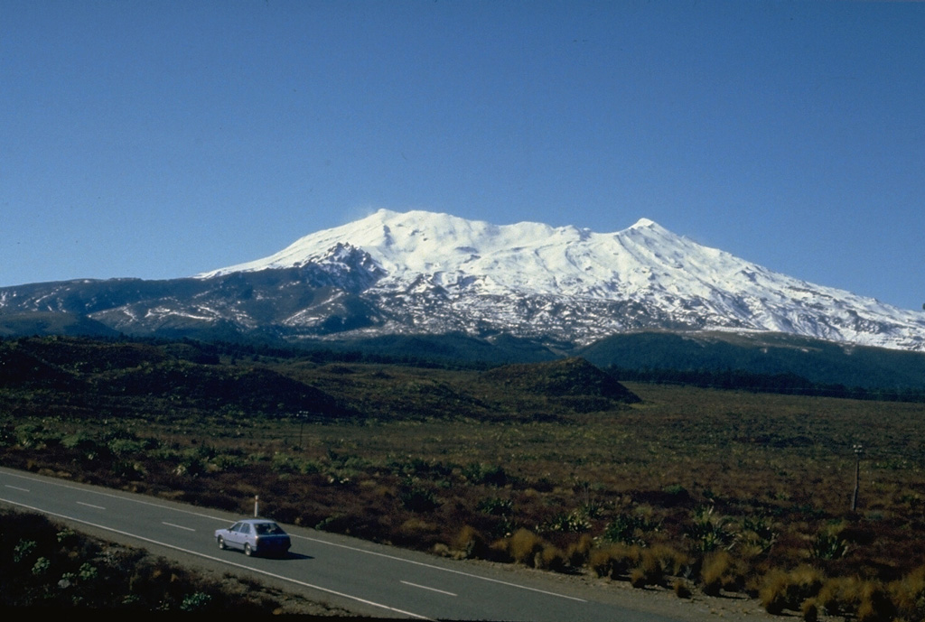New Zealand's Ruapehu volcano, seen here from the W, has been constructed by incremental growth of partially overlapping volcanic edifices during the past 250,000 years. The compound volcano has a volume of 110 km3, and another 100 km3 of volcaniclastic debris forms a ring plain surrounding Ruapehu. Te Heu Heu and Girdlestone Peaks form the high points at the N and S ends, respectively. Photo by Jim Cole (University of Canterbury).
