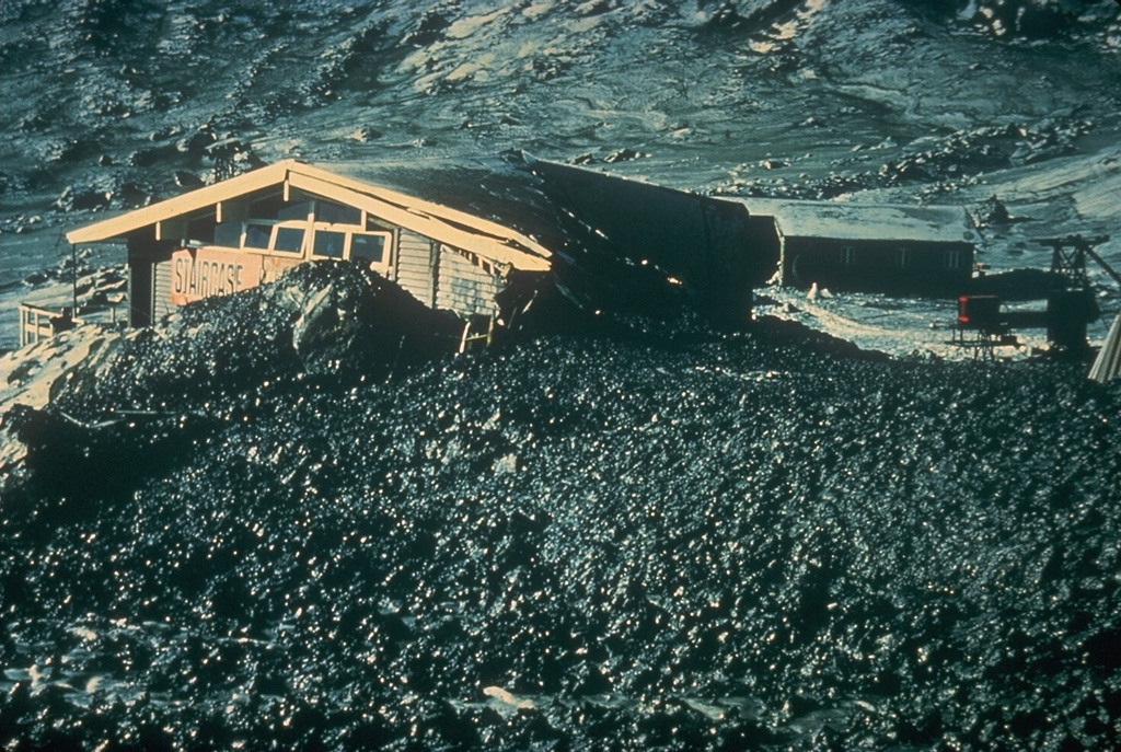 A restaurant at the Whakapapa ski area on the upper flanks of Ruapehu volcano was damaged by a lahar that originated from an explosive eruption on 22 June 1969. The lahar was produced by hot water ejected from the Crater Lake vent and snowpack around the crater that was melted by pyroclastic surges and hot tephra. Photo by Lloyd Homer (New Zealand Geological Survey).