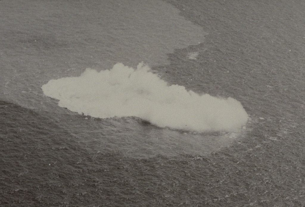 Submarine explosions took place at Kavachi from 28 October to 7 November 1969. This photo on the first day of the eruption shows steam rising above an area of water discoloration. Renewed explosions began on 22 December and a new island was first seen on 30 January. The last eruptions were observed on 6 February and the new island was eroded to below sea level by wave action between 7-17 February. Photo by Chris Tabona, 1969.