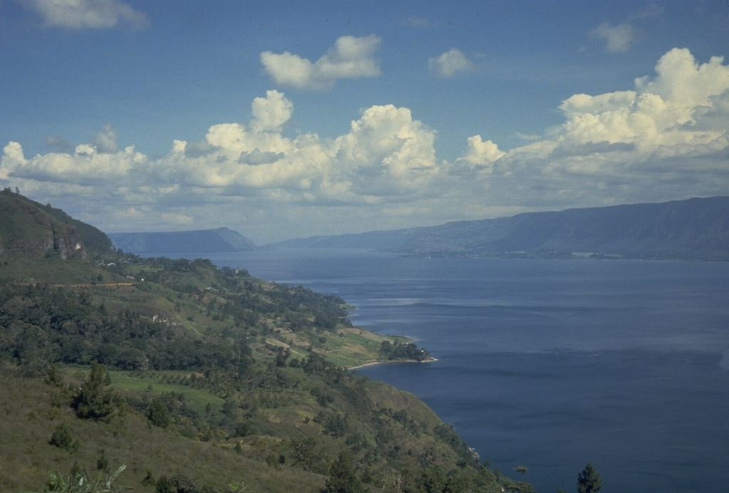 The 35 x 100 km Toba caldera was formed during four powerful explosive eruptions beginning 1.2 million years ago. The latest of these, about 74,000 years ago, was one of the world's largest known Quaternary eruptions, producing the Young Toba Tuff (YTT). Photo by Tom Casadevall, 1987 (U.S. Geological Survey)
