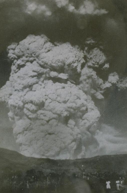 A powerful eruption column rises above Kelud volcano on 31 August 1951.  Construction of a tunnel system lowered the level of the crater lake at the summit following the devastating eruption in 1919 that killed 5110 people.  As a result, only seven people lost their lives in the 1951 eruption. Photo from the collection of Maurice and Katia Krafft.