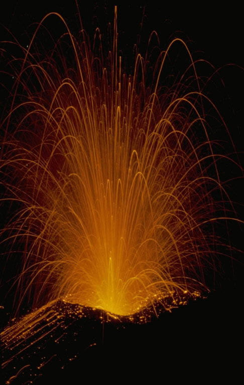 Strombolian explosions produce incandescent ejecta during an eruption of Batur volcano on Bali on August 20, 1971.  Exposive eruptions took place from March 11 until August.  Incandescent bombs were ejected to 100 m above the vent, and the maximum height of the ash column was 300 m. Copyrighted photo by Katia and Maurice Krafft, 1971.