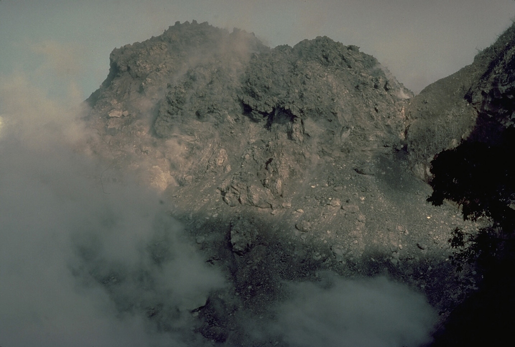 Anak Ranakah, a new lava dome that began growing on December 28, 1987, is seen here on February 25, 1988.  By June of 1988 the dome had reached a height of 150 m. Copyrighted photo by Katia and Maurice Krafft, 1988.