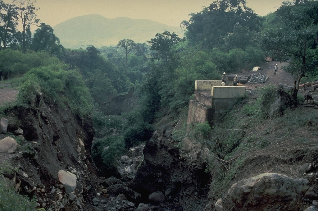 Highway bridge was destroyed by a pyroclastic flow from partial collapse of the growing lava dome of Anak Ranakah on Flores Island in 1988. Copyrighted photo by Katia and Maurice Krafft, 1988.