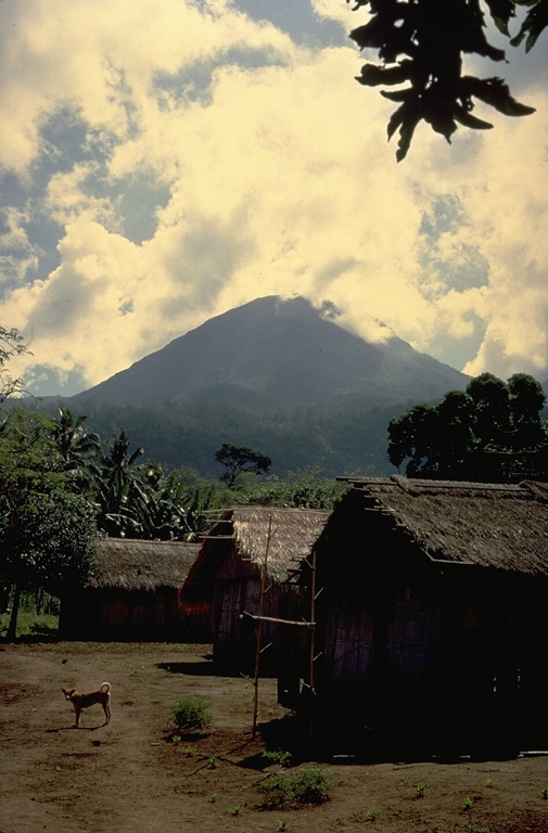 The Lewotobi "Husband and Wife" twin volcano is composed of the Lewotobi Lakilaki (seen in this view) and Lewotobi Perempuan stratovolcanoes, whose summits are less than 2 km apart on a NW-SE line.  The summits of both volcanoes contain lava domes.  Lewotobi Perempuan has had historical eruptions only in 1921 and 1935, whereas Lewotobi Lakilaki is one of the most active volcanoes on Flores Island, with frequent eruptions in the 19th and 20th centuries. Copyrighted photo by Katia and Maurice Krafft, 1971.