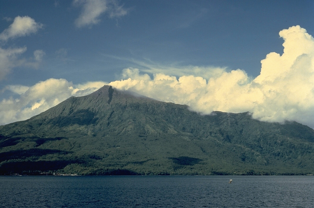 Karangetang volcano, also known as Api Siau, is one of Indonesia's most active volcanoes, with more than 40 eruptions recorded since 1675.  Located in the center of the Sangihe island chain north of Sulawesi, Karangetang contains five summit craters oriented along a N-S line.  Frequently active in the 20th century, Karangetang has produced  explosive eruptions, lava dome growth, and pyroclastic flows. Copyrighted photo by Katia and Maurice Krafft, 1971.