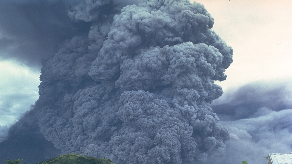 A pyroclastic flow travels down the SE flank of Mayon volcano in the Philippines on 24 September 1984. An ash plume rises above the moving pyroclastic flow, which was the largest of a series of pyroclastic flows that occurred during an eruption that began on 9 September. The pyroclastic flow traveled 7 km from the summit vent; velocities of 50 m/s were estimated from photographs. Photo by Ernesto Corpuz, 1984 (Philippine Institute of Volcanology and Seismology).