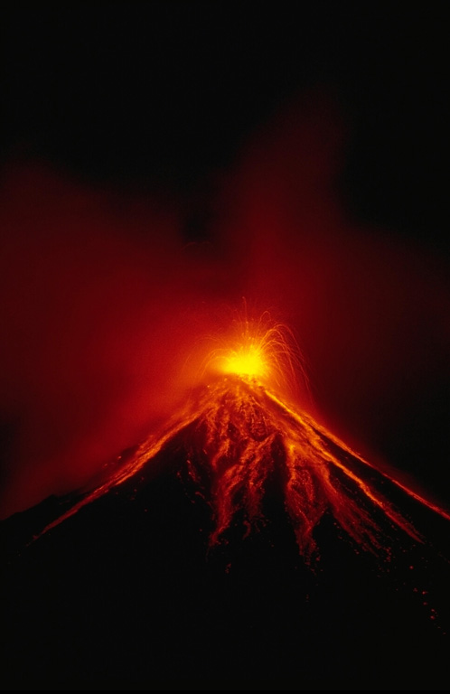 A Strombolian eruption on 15 September 1984 ejected incandescent blocks that rolled down the flanks of Mayon. Sustained lava fountaining produced lava agglutinate that congealed on the upper flanks around the vent. This eruption, which began on 9 September, also produced powerful vertical explosions and pyroclastic flows that traveled out to 7 km from the summit. Photo by Ernesto Corpuz, 1984 (Philippine Institute of Volcanology and Seismology).