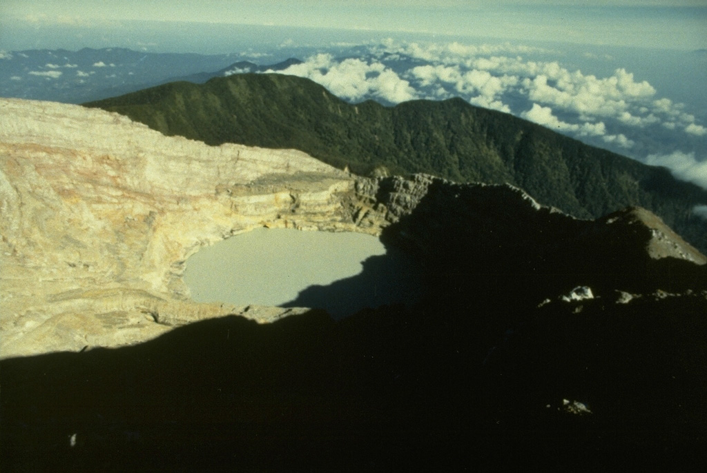 The youngest crater of Dempo volcano, at the WNW end of a series of six partially overlapping craters at the summit, contains a 400-m-wide crater lake that has been the source of frequent phreatic eruptions during historical time. A seventh smaller crater is located on the upper N flank. Dempo is one of Sumatra's most active volcanoes, frequently producing small-to-moderate explosive eruptions. Photo by Ruska Hadian, 1989 (Volcanological Survey of Indonesia).
