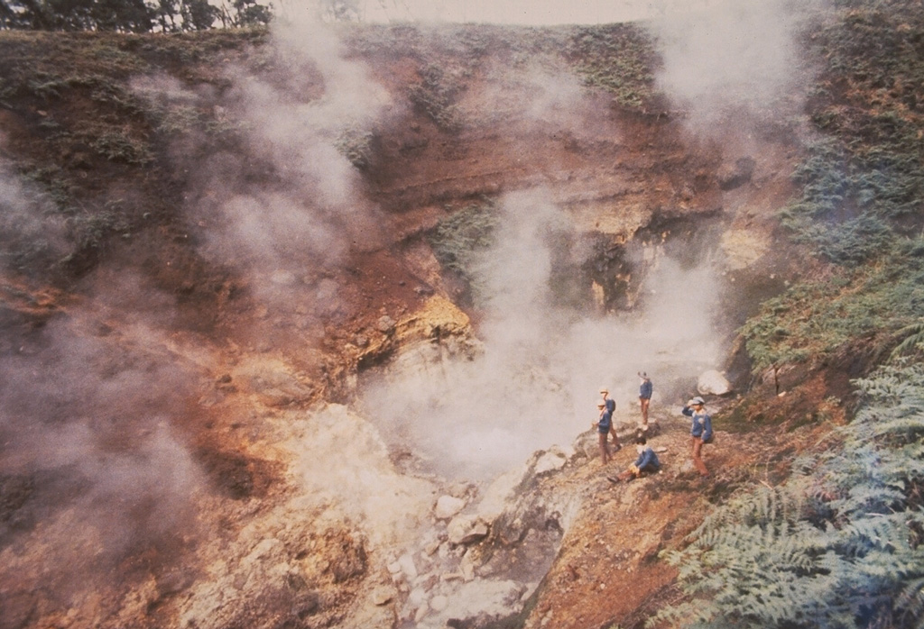 Scientists from the Volcanological Survey of Indonesia monitor the steaming Condrodimuko crater in the Dieng volcanic complex of central Java. The Dieng plateau contains a large amount of phreatic explosion craters, many of which have erupted during historical times, sometimes with fatal consequences. The only known eruption in the Kawah Condrodimuko area took place in December 1954, when an eruption was observed ejecting a thick black plume for half an hour. Photo by Sumarma Hamidi, 1973 (Volcanological Survey of Indonesia).