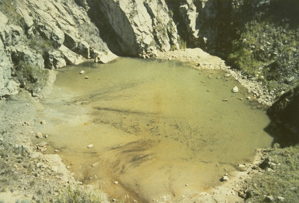 A shallow lake is seen here on the floor of the K1 crater at the summit of Sundoro volcano in 1973. The 150-m-wide, 75-m-deep crater is seen here from the rim of the K2 crater immediately to the south. Photo by Sumarma Hamidi, 1973 (Volcanological Survey of Indonesia).