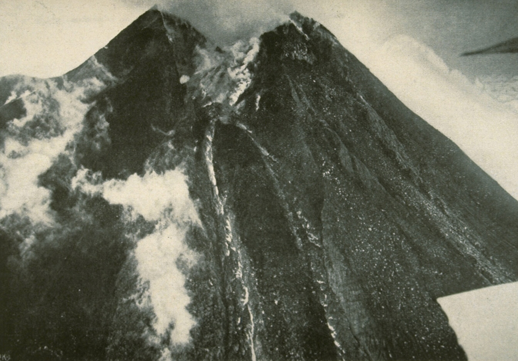 A lava flow at the center of the photo descends from the breached summit crater of Merapi on 27 April 1931 following the devastating eruption of 18 December 1930. Photo published in Neumann van Padang, 1933 (courtesy of Volcanological Survey of Indonesia).