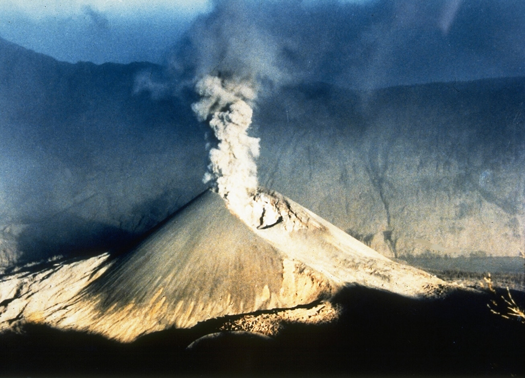 An ash plume rises above Barujari cone of Rinjani volcano on 30 June 1994, with the S Segara Anak caldera wall in the background. Intermittent eruptions took place from 3 June until 21 November and produced plumes up to 3 km above the crater and a lava flow on its N flank. Photo courtesy of Volcanological Survey of Indonesia, 1994.