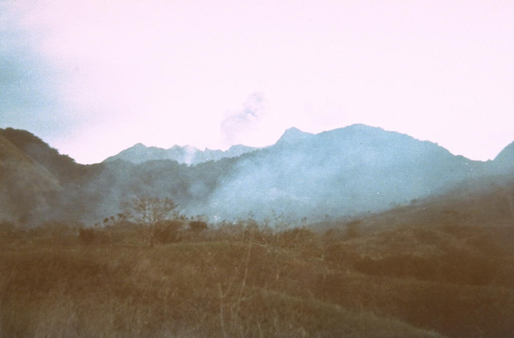 An eruption of Doro Api at Sangeang Api volcano is observed from the village of Doro Mewanga on 18 September 1964. The eruption began on 29 January 1964 and lasted until the end of 1965. During the eruption strong explosions took place from the summit crater and a lava flow traveled down to 750 m elevation. Photo courtesy of Volcanological Survey of Indonesia, 1964.