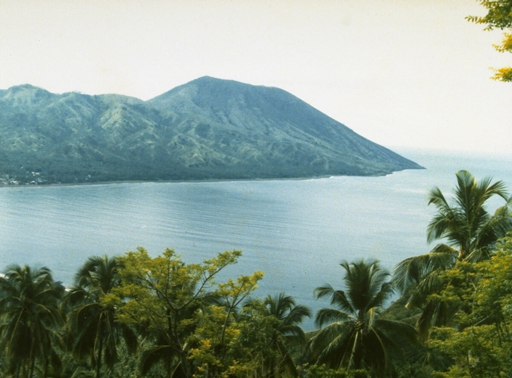 The small Iya volcano is at the southern end of a peninsula on central Flores Island, seen here from the village of Kori Bari on the NW. Intermittent explosive eruptions have been recorded since 1671. Photo by Ruska Hadian, 1985 (Volcanological Survey of Indonesia).