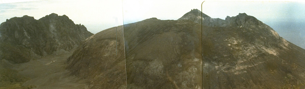 A lava dome, formed during the first historical eruption of Iliwerung volcano in 1870, occupies the summit crater of the volcano, seen here in 1979 from the western rim of Ado Wajung crater.  Iliwerung forms one of the south-facing peninsulas on Lembata (Lomblen) Island, and has a series of lava domes and craters along N-S and NW-SE lines.  Many of these vents, including submarine vents offshore, have erupted in historical time. Photo by Ruska Hadian, 1979 (Volcanological Survey of Indonesia).
