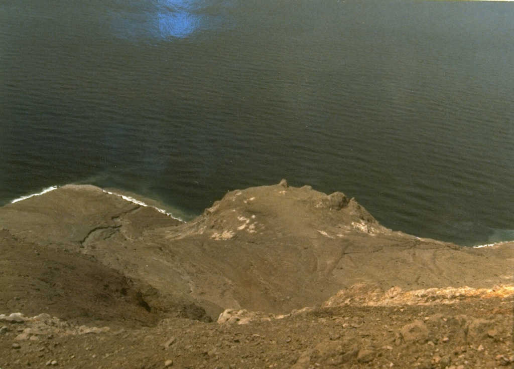 Iligripe lava dome on the SE flank of Iliwerung volcano on Lembata (formerly Lomblen) Island formed during an eruption from April 7 to November 26, 1948.  Growth of the 190-m-high lava dome, seen here at the center of this 1979 photo, was accompanied by explosive eruptions and pyroclastic flows. Photo by Ruska Hadian, 1979 (Volcanological Survey of Indonesia).