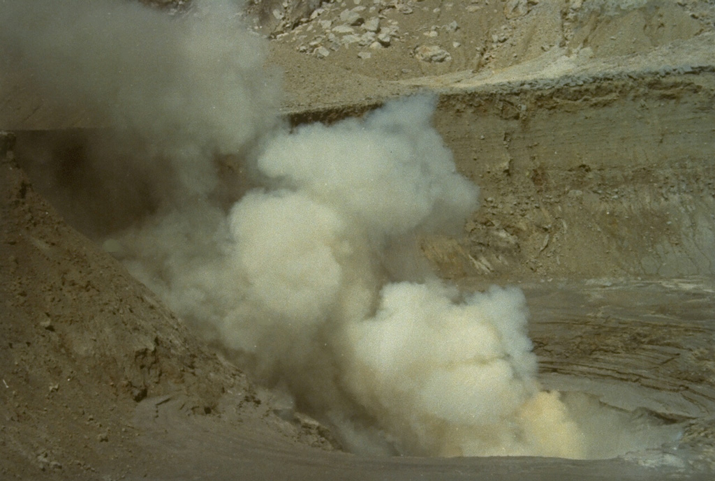 Steam rises from a fumarole in the crater complex B, seen here from the NE.  The summit of Gunung Sirung is cut by many craters and explosion pits, five of which contain lakes. Photo by L.D. Reksowirogo, 1972 (Volcanological Survey of Indonesia).