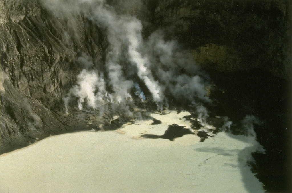 Mahawu volcano, located immediately to the east of Lokon-Empung volcano, contains a 450-m-wide, 140-m-deep summit crater.  Active fumaroles are seen in this 1991 photo of the north end of the crater, which sometimes contains a crater lake.  Small-to-moderate explosive eruptions have been recorded at 1331-m-high Mahawu volcano since the 18th century. Photo by Ruska Hadian, 1991 (Volcanological Survey of Indonesia).
